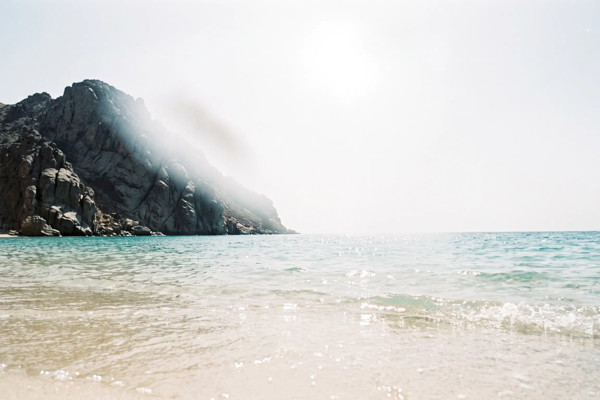 A cove on the Red Sea coast of Sinai under a white sun (generated image)